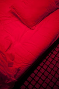 red futon, bathing in red light